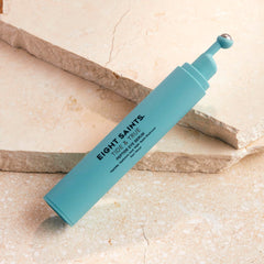 Eight Saints Tide & True Eye Serum roller ball in action delivering a cooling depuff under the eye.