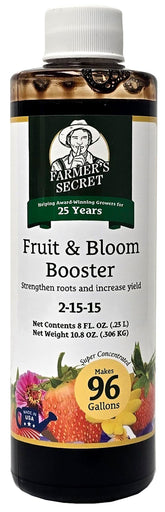 Farmer's Secret Fruit & Bloom Booster bottle pour shows easy application for fruiting and blooms.