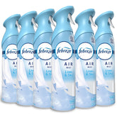 Febreze Air Mist Linen & Sky spray bottle releasing a fresh odor-neutralizing scent in any room