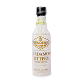Fee Brothers Cardamom Bitters bottle pour enhances cocktail depth.