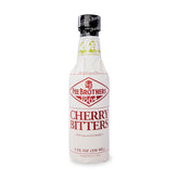 Fee Brothers Cherry Bitters bottle close-up highlighting cherry aroma for cocktails.