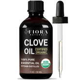 Fiora Naturals Organic Clove Oil bottle pour for pure DIY wellness blends