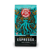 Fire Department Coffee Shellback Espresso beans on table, bold aroma for morning wake-up.