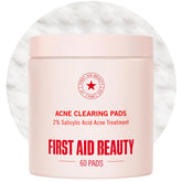 First Aid Beauty Acne Pads bottle pour for easy, on-the-go blemish control.