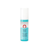 First Aid Beauty dark spot serum bottle shows targeted brightening for uneven skin tone.
