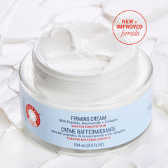 First Aid Beauty firming cream jar closeup highlights creamy texture for easy application.