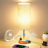 Fitfull table lamp with AC outlet and USB-C port powers bedside devices.