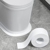 Fixmend white caulk tape sealing bathroom seam for a cleaner look
