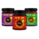 FlybyJING Original Chili Crisp jar on counter, versatile topping for noodles, eggs, and meats.