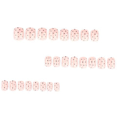 Foccna 24-piece set of glossy polka-dots nails for quick, salon-like style.