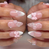 Foccna pink press-on nails with 3D flowers for a quick at-home manicure.