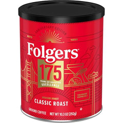Folgers Classic Medium Roast coffee grounds being scooped for versatile brewing.