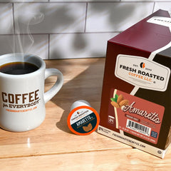 Fresh Roasted Coffee Amaretto pods pour closeup captures smooth texture and flavor release.