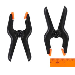 FRICHOM orange gripper clamp rotates to fit different objects for versatility