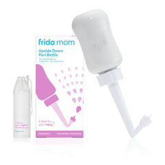 Frida Mom Upside-Down Peri Bottle angled use for gentle postpartum cleansing.