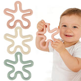 Fu Store coral flower teether, top view, ergonomic grip supports tiny hands.