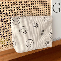Gardsell corduroy bag open to reveal organized makeup, jewelry, and toiletries.