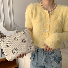 Gardsell smiley-dots detail on bag offers playful style for everyday vanity.