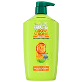 Garnier Fructis Grow Strong conditioner bottle highlighting fullness for fine hair.