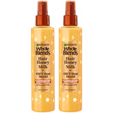 Garnier Whole Blends Hair Honey Milk bottle on display, honey-infused protection for styling.