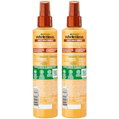 Garnier Whole Blends ingredients panel with acacia honey, highlighting natural nourishment.