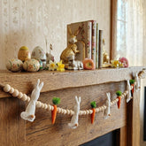 Gee Hut Easter Bunny Garland on mantel adds cozy farmhouse charm.