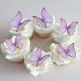 GEORLD edible wafer butterflies for cake decoration with a delicate purple hue and subtle 3D feel.