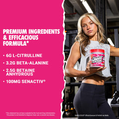 Dissolving Ghost Legend Bubblicious Strawberry Splash powder in water for a smooth pre-workout mix.