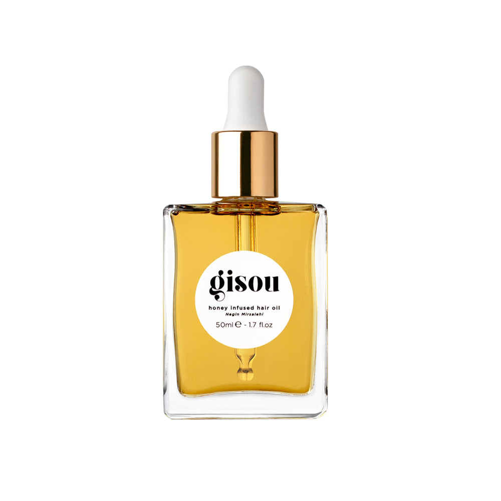 Gisou Honey Infused Hair Oil bottle pour demonstrates lightweight hydration for hair health