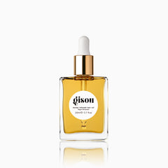 Gisou Honey Infused Hair Oil mini bottle prepared for travel and shine