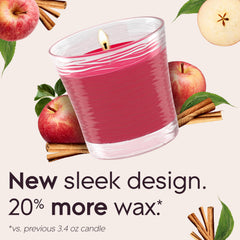 Glade Apple Cinnamon candle jar lit with warm glow enhances relaxing evenings