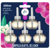 Glade PlugIns Orchid & Neroli bottle closeup highlighting fresh floral fragrance