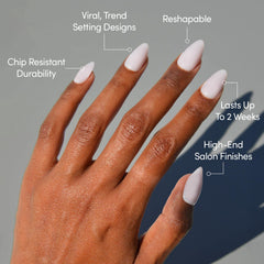 Close-up of Sugar Doll almond nails highlighting the soft milky pink shade