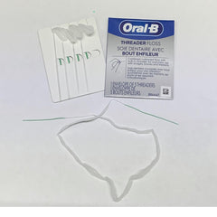 GLIDE Threader Floss in use around braces with soft floss