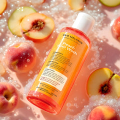 Glo Melanin Peach Yoni Wash foaming texture suggesting gentle cleansing.