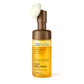 Glo Melanin Turmeric & Kojic Foaming Wash bottle with scrubber top for brightening cleanse.