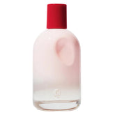 Glossier You bottle close-up emphasizes skin-scent concept for a personal fragrance.