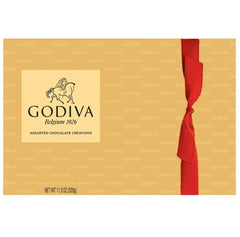 Open Godiva gift box revealing the 27-piece assortment in premium packaging