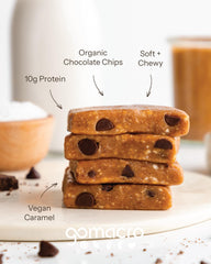 GoMacro Salted Caramel Chocolate Chips Bar in hand shows a convenient workout friendly snack