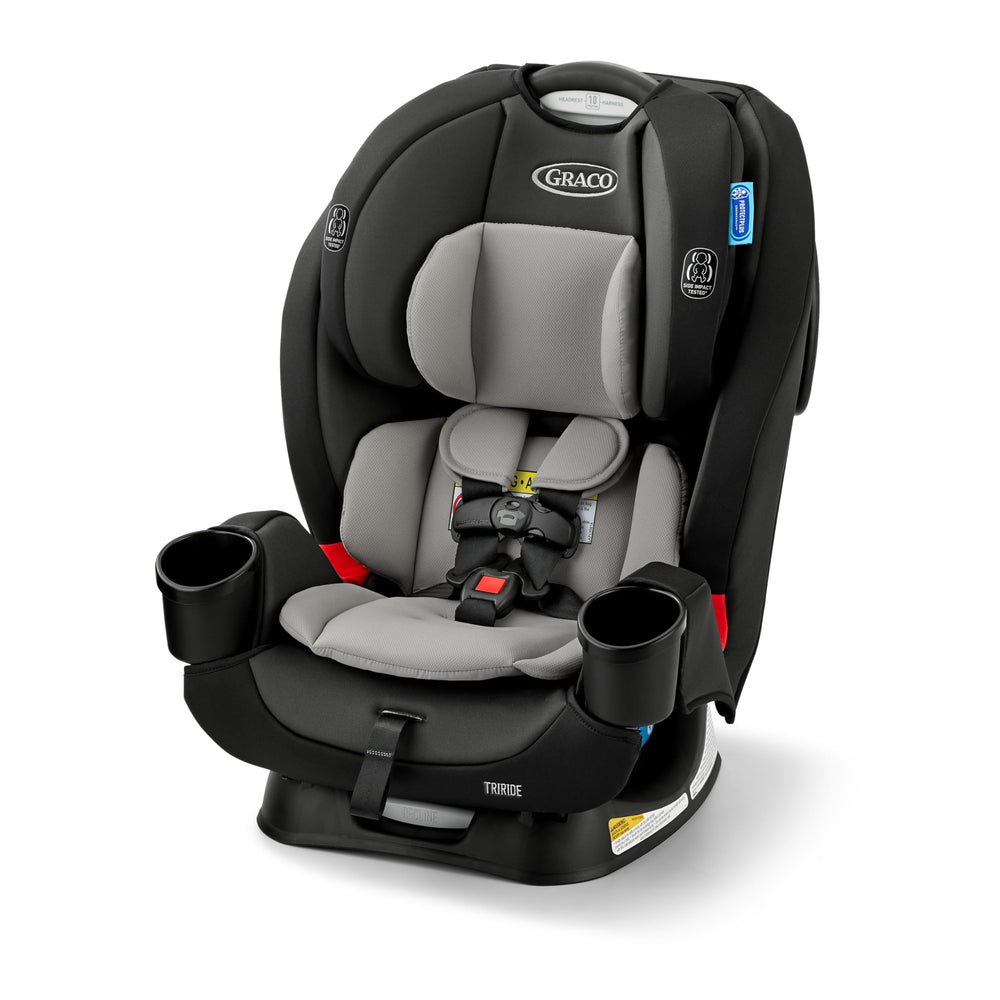 Graco TriRide rear-facing harness for newborns and toddlers secured on the road.