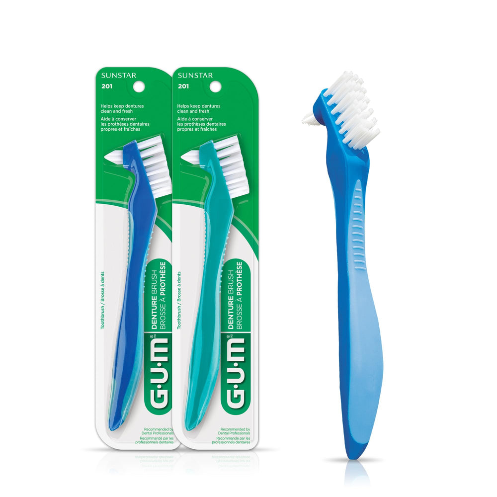GUM Denture Brush dual-head with flat bristles for broad surfaces.