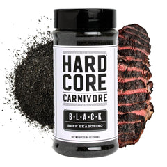 Hardcore Carnivore Black bottle front view for bold charcoal seasoning on steaks.
