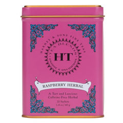 Harney and Sons Raspberry Herbal tea brewing in a glass teapot, inviting bright flavor.