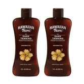 Hawaiian Tropic Dark Tanning Oil bottle on sandy beach for hydration
