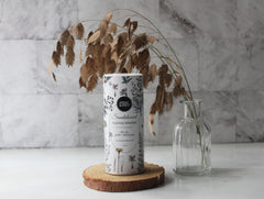 Herb & Root Sandalwood dusting powder on feet demonstrates fresh, odor-controlled wear.