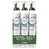 Herbal Essences Curl Boosting Mousse bottle delivering long-lasting hold