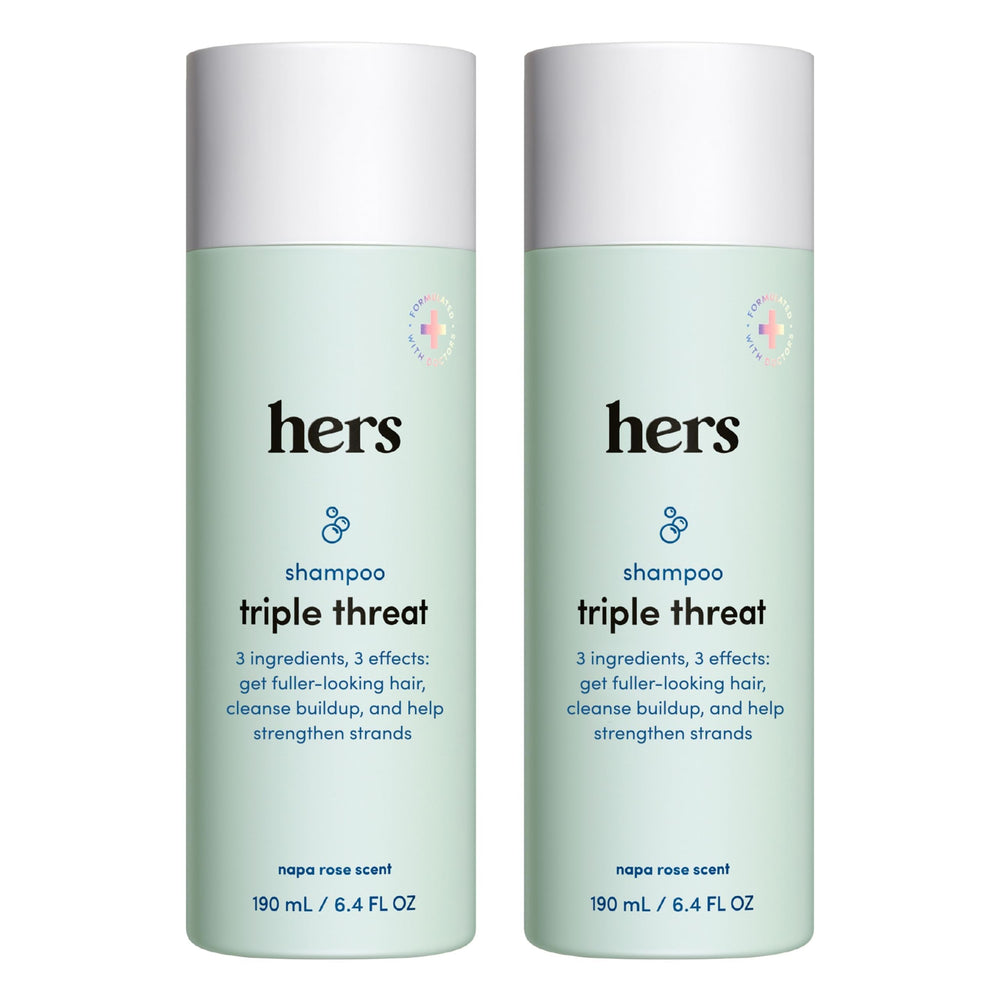 Hims & Hers Triple Threat Shampoo bottle close-up, biotin-enhanced formula for fuller hair.