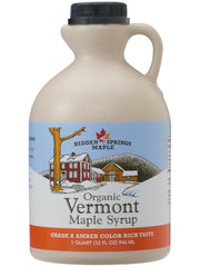 Hidden Springs Maple Amber Rich syrup bottle on waffles, ideal for breakfast toppings.