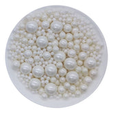Homankit edible white sugar pearls on cake add elegant decoration and festive sparkle.