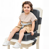 HOMEAL booster seat on a kitchen chair with adjustable straps for secure, longer family meals